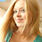 Second pic of Skye loves to tease with her perky tits as she leans over and squeezes them together