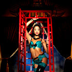 First pic of Kinky porn star Skin Diamond peels off latex lingerie in a cage