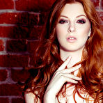 Second pic of Shaun Tia Saucy Redhead in Sheer Black Stockings