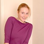 First pic of Blonde in black stockings shows her bushy pussy