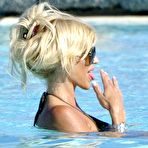 Second pic of Victoria Silvstedt cleavage in green bikini poolside shots in Porto Cervo