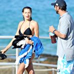 First pic of Jessica Hart in black bikini on the beach