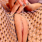 Second pic of Nicoleta uses a speculum on her sweet puffy pussy