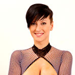 Fourth pic of Nicoleta uses a speculum on her sweet puffy pussy