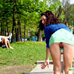 Third pic of Public flashing - Sexy flasher posing with people in her background