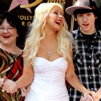 Third pic of Christina Aguilera shows deep cleavage in pink tight dress