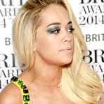 First pic of Rita Ora slight cleavage in yellow dress