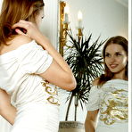 First pic of Natalia and her captivating reflection in a vanity mirror makes an erotic twin vision of a smoking hot babe.