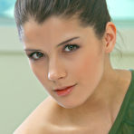 First pic of Horny teen brunette Luiza A strips her green shirt and unveils her perky boobs and nipples. - TheMetArt.com