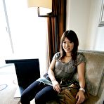 Second pic of Yuzuka smiles and shows hairy twat close up @ Idols69.com FMG's