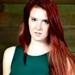 First pic of SexPreviews - Ashley Lane redhead is bound in dungeon with leather mask and dribbling