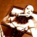 Fourth pic of FetishDolls.com | Bondage & Lesbian Fetish Videos, Kinky Fetish Girls, 
Kinkiest Lesbian Fantasies, featuring boot and heel worship, sexy smoking, spankings 
and nipple torment, and tons of sloppy wet strap-on sex and anal play