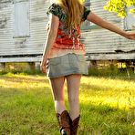 First pic of Trixie in cowboy boots & faded jeans skirt