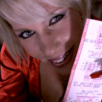 Fourth pic of Cougar Nikki takes your lotto ticket by teasing you with long fingernails 
and big tits.