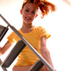 First pic of Pantyless Redhead On Ladder Showing Her Tight Pussy And Ass