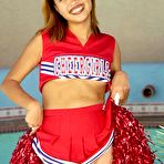 Second pic of Petite Teen Asian Cheerleader Flashing Her Shaved Pussy