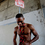 Third pic of Big Dick Black Muscular Porn Actor CJ Wright stripping in public