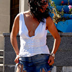 First pic of Raunchy brunette in smooth pantyhose smelling fragrant aroma of her flowers