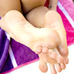 Second pic of Eva Angelina Gives a Footjob and Gets Cum on Her Feet