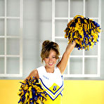 Third pic of Sexy Olympics - Hot cheerleader girl Anne Taylor undresses and her big silicone tits pop out of the uniform