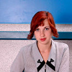 First pic of Red Haired Amateur Teen In Stockings Strip Teasing On A Desk