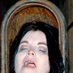 Fourth pic of latex hood forms to her face and neck