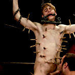 Fourth pic of Teen gay boy abused in rough bdsm fuck by dirty master that pinches spanks and bangs him