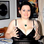 First pic of Dark-haired doll licks her own ripe massive boobs
