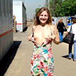 First pic of Public flashing - Busty exhibitionist babe walks in the rain topless