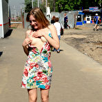 Second pic of Public flashing - Busty exhibitionist babe walks in the rain topless