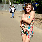 Third pic of Public flashing - Busty exhibitionist babe walks in the rain topless