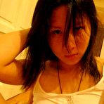 Fourth pic of Me and my asian Asian coed goes full nude in couch shows squeezable tits