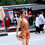 First pic of Public flashing - Busty exhibitionist babe walks in the rain topless