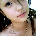 Fourth pic of Me and my asian Asian coed goes full nude in couch shows squeezable tits