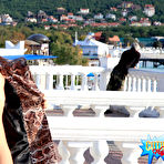 Second pic of Public flashing - Busty exhibitionist babe walks in the rain topless