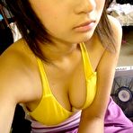 Fourth pic of Me and my asian Asian coed goes full nude in couch shows squeezable tits