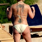 Second pic of Anastacia sunbathing in yellow bikini in Porto Cervo