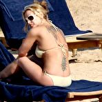 Fourth pic of Anastacia sunbathing in yellow bikini in Porto Cervo