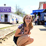 Fourth pic of Public flashing - Busty exhibitionist babe walks in the rain topless