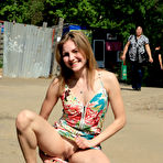 Second pic of Public flashing - Busty exhibitionist babe walks in the rain topless