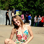 Fourth pic of Public flashing - Busty exhibitionist babe walks in the rain topless