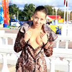 Third pic of Public flashing - Busty exhibitionist babe walks in the rain topless