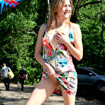 Fourth pic of Public flashing - Busty exhibitionist babe walks in the rain topless