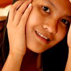 Fourth pic of Alluring asian teenie Kat Young fingerin and posing on bed