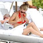 First pic of Jenny McCarthy cleavage in red bikini on Miami Beach