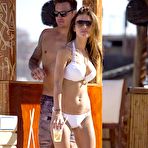 First pic of Busty Audrina Patridge in white bikini on the beach