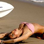 Third pic of Monica Goe posing in skimpy thong on the beach