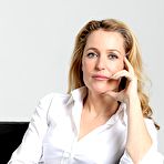 First pic of Gillian Anderson in white blouse & black trousers