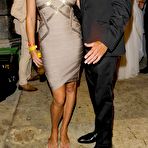 First pic of Rebecca Romijn shows cleavage in red night dress