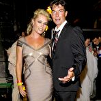 Fourth pic of Rebecca Romijn shows cleavage in red night dress